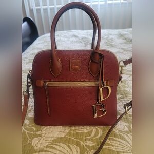 Dooney & Bourke Pebble Grain Leather Domed Satchel In Wine